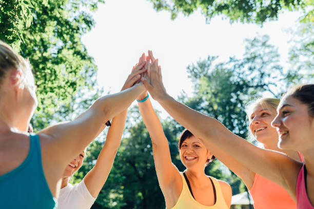 istock Group Of Athletes Give Each Other High Five 1314237992