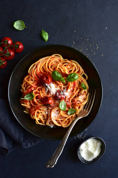 istock Spaghetti pasta with gilled tomatoes, garlic and sauce 1314238777