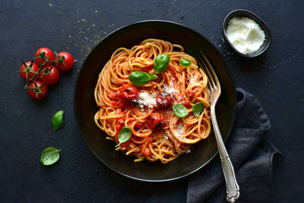 istock Spaghetti pasta with gilled tomatoes, garlic and sauce 1314238869