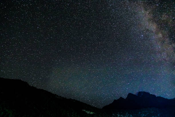 istock Starry sky and milky way with bright stars over mountains. 1314238914