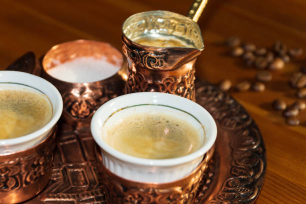 istock Oriental coffee in traditional Turkish copper coffee pot and matching cup 1314238924
