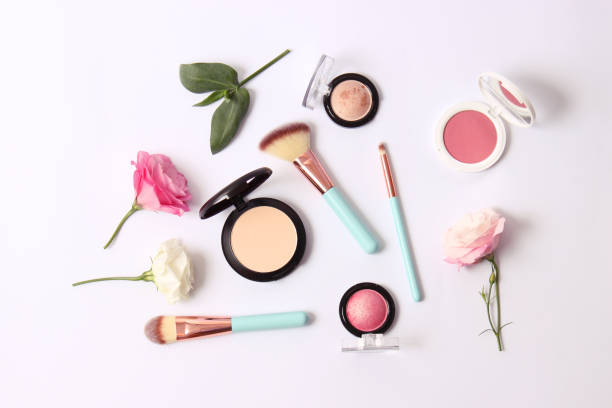 istock Cosmetics and flowers on a light background top view. 1314239919