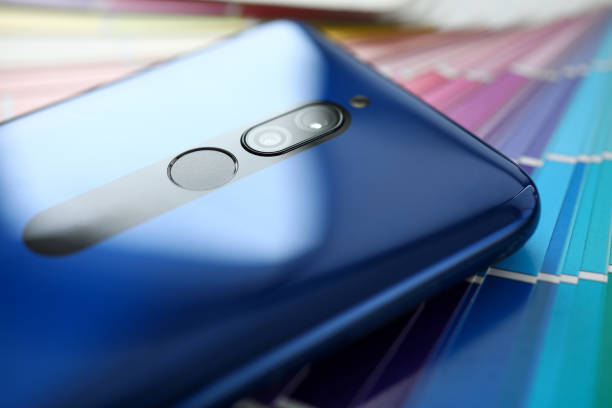 istock Modern blue smartphone lying at colorful fantail 1314240030