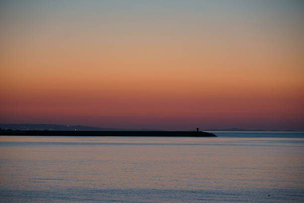 istock Lighthouse with green light in the dusk 1314242648