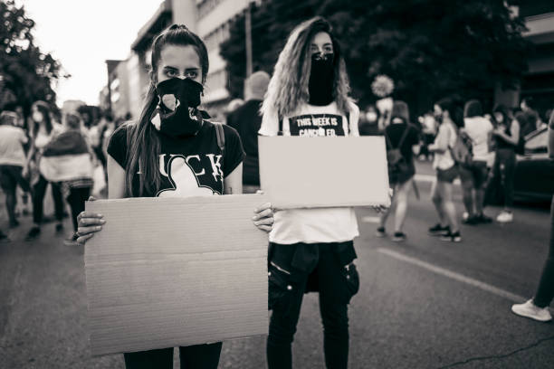istock Young women protesters holding blank placards 1314243479
