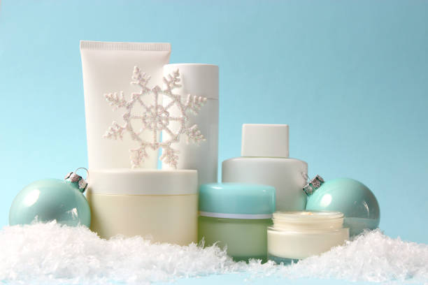 istock Winter care cosmetics on a colored background top view. 1314243536