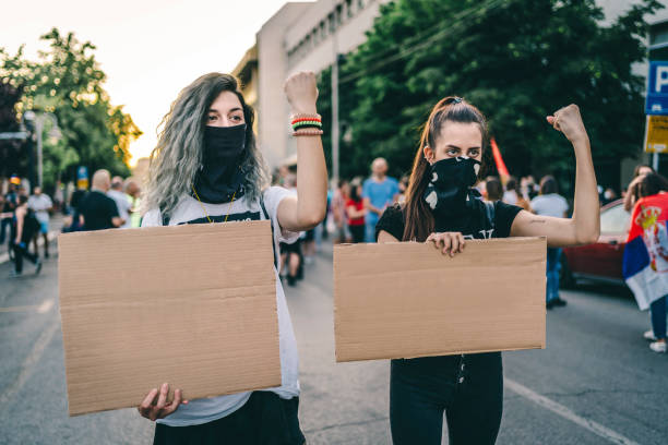 istock Young women protesters holding blank placards 1314243923