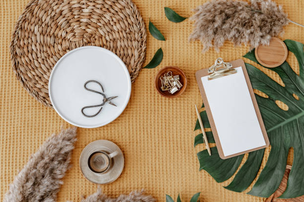 istock minimal home workspace desk with notebook, monstera, brown background. Flat lay, top view bohemian lifestyle freelance blog. 1314244551
