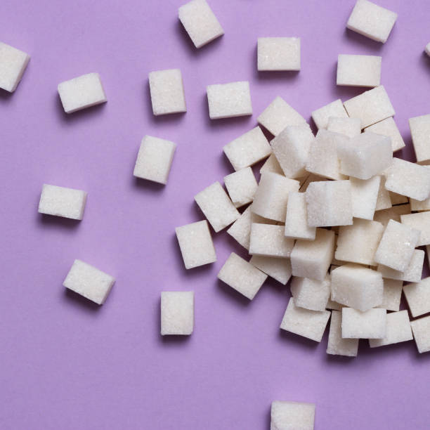 istock Refined sugar on a colored background. Diabetes concept, excess sugar 1314245491