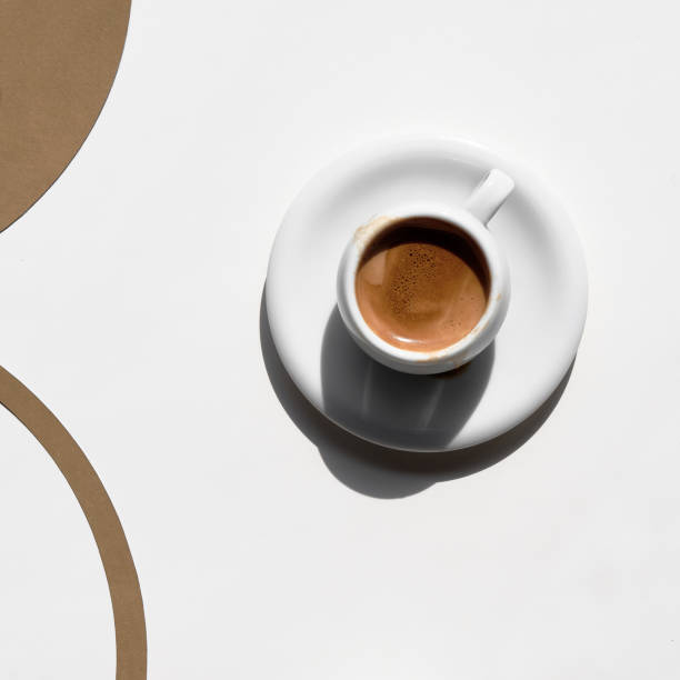 istock Espresso coffee cup, simple minimal arrangement. White brown geometric flat lay, square composition 1314250917