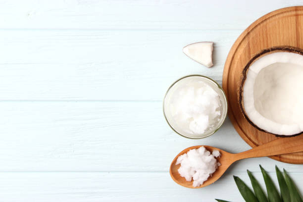 istock coconut oil and coconuts, palm branches close up 1314252829