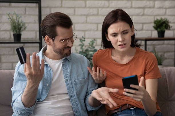 istock Annoyed couple paying online dissatisfied with bad bank app work 1314253003