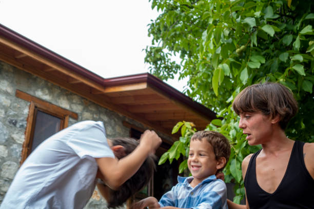 Mother and her sons together in garden
