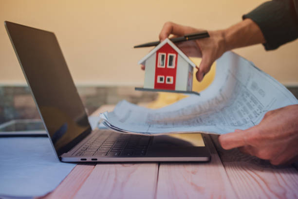 istock Engineer design planning house building project by computer laptop blueprint 1314258225