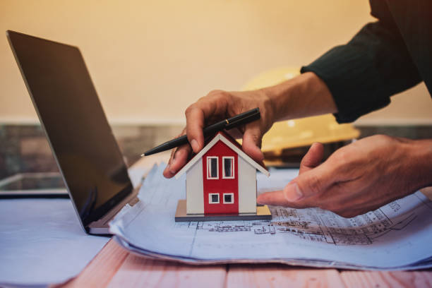 istock Engineer design planning house building project by computer laptop blueprint 1314258271