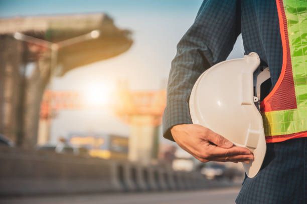 istock Technician hold helmet hard hat safety on road construction , Engineer Architecture worker 1314258915