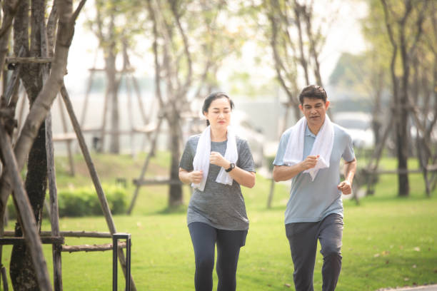 istock Asian man women running jogging exercise 1314258952