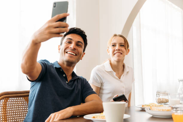 istock Mother taking selfie with daughter during breakfast 1314260355