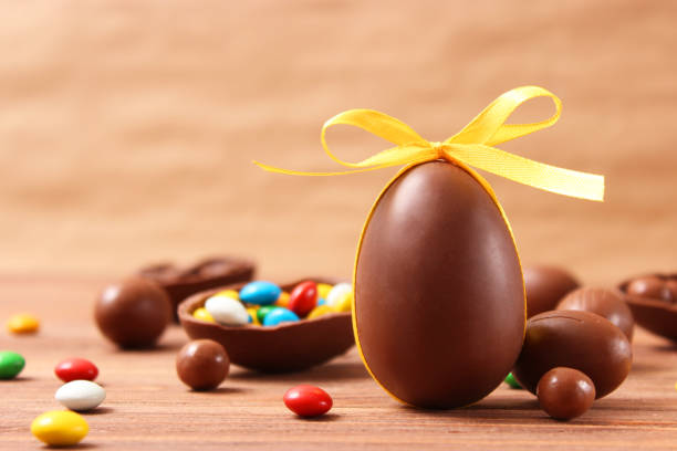 istock Easter composition with chocolate eggs and chocolate rabbit on wooden background 1314264132