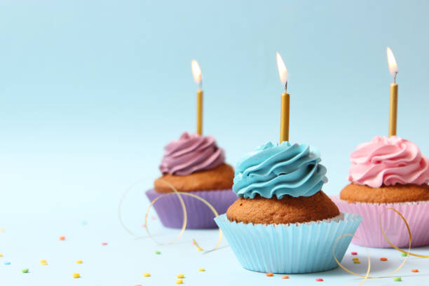 istock Delicious cupcake with a candle on a colored background 1314265060