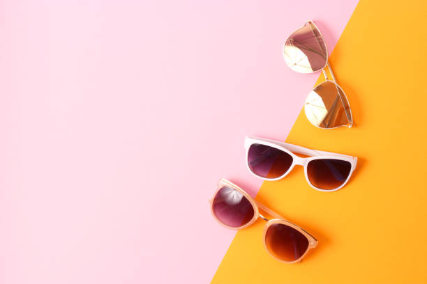 istock set of sunglasses on a colored background top view. 1314265083