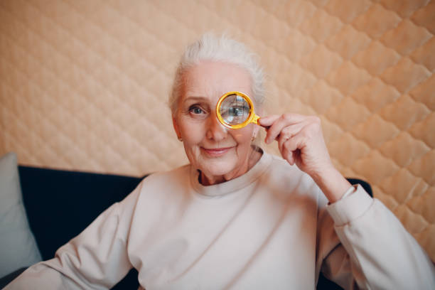 istock The elderly woman with magnifier loupe in hand 1314266711