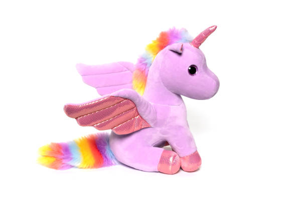 istock Unicorn plush toy sitting. Isolated on white background 1314268450