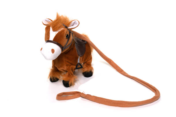 istock Brown fluffy horse toy isolated on white. 1314270099