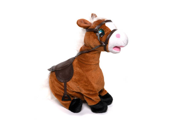 istock Brown fluffy horse toy isolated on white. 1314270119