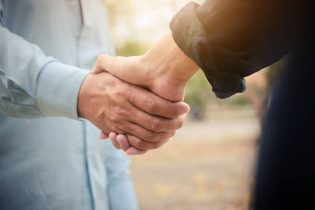 istock Group people hand in hand concept partner teamwork community 1314270122
