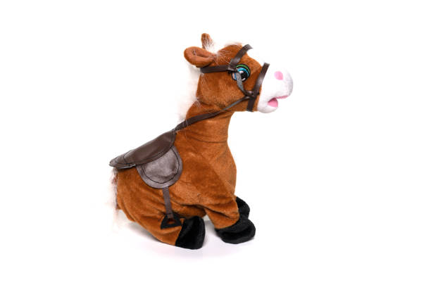istock Brown fluffy horse toy isolated on white. 1314270139