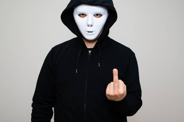 istock Hacker with blank mask showing his middle finger 1314270249