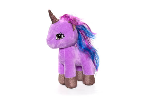 istock Unicorn plush toy sitting. Isolated on white background 1314273170