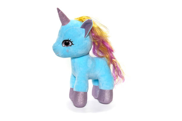 istock Unicorn plush toy sitting. Isolated on white background 1314273173