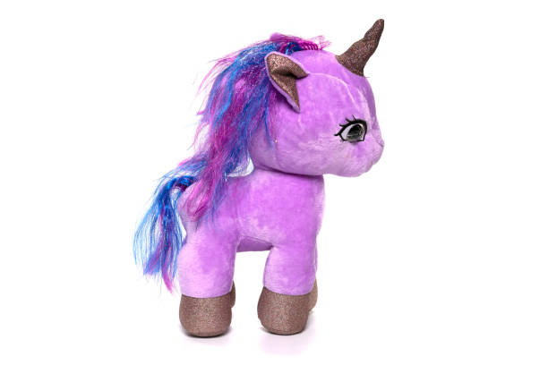 istock Unicorn plush toy sitting. Isolated on white background 1314273175