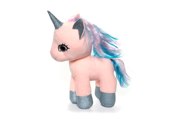 istock Unicorn plush toy sitting. Isolated on white background 1314273178
