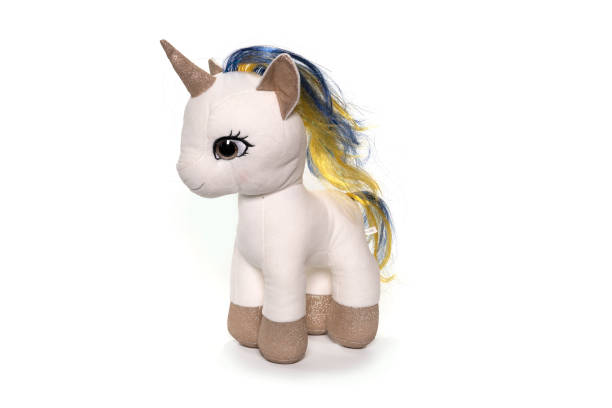 istock Unicorn plush toy sitting. Isolated on white background 1314273200