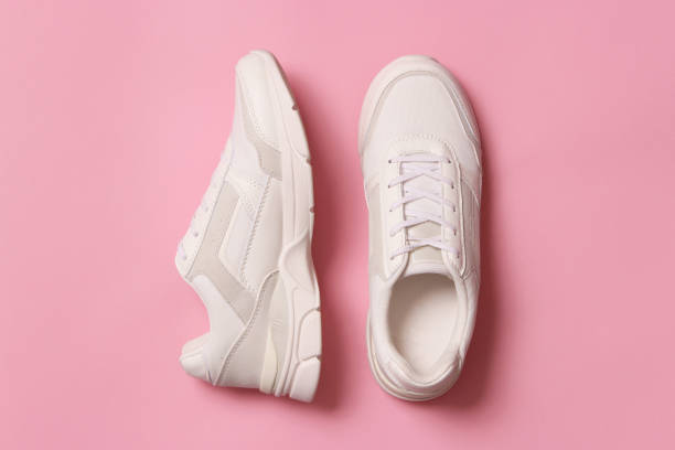 istock women's sneakers on a colored background top view. Women's shoes. 1314274014