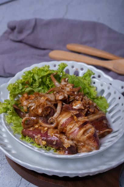 istock Fried squid with garlic in a semic dish 1314275502