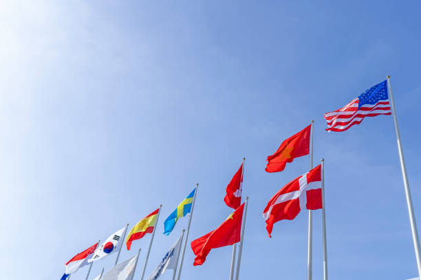 istock Flagpole international global with blue sky background 1314275728
