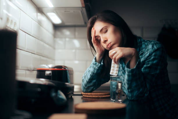 istock Woman Holding Pill Tablet Having Pains During Night Time 1314277689