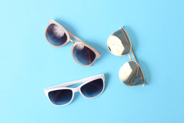 istock set of sunglasses on a colored background top view. 1314279275