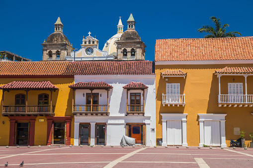 Spanish colonial architecture in one square with colourful houses in the historical city center of Cartagena de Indias