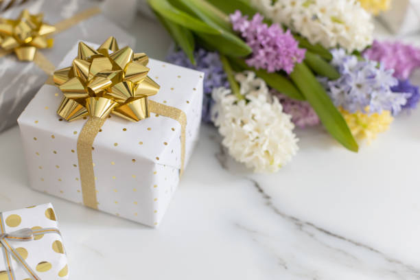 istock trendy composition with festive wrapped gift boxes ribbon bow decorated by bloom flowers 1314284839