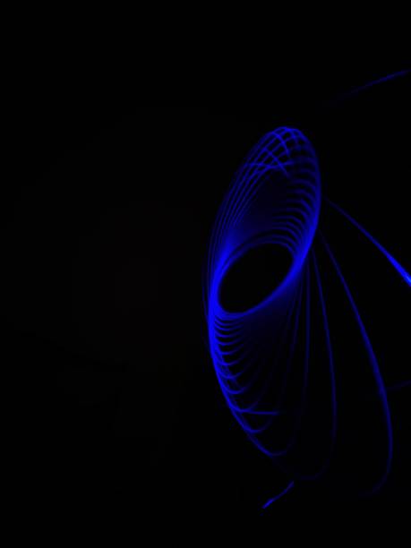 istock Closeup of Neon Blue Spirograph geometric abstract pattern isolated in a Black background. Chakra. Light painting. 1314285503