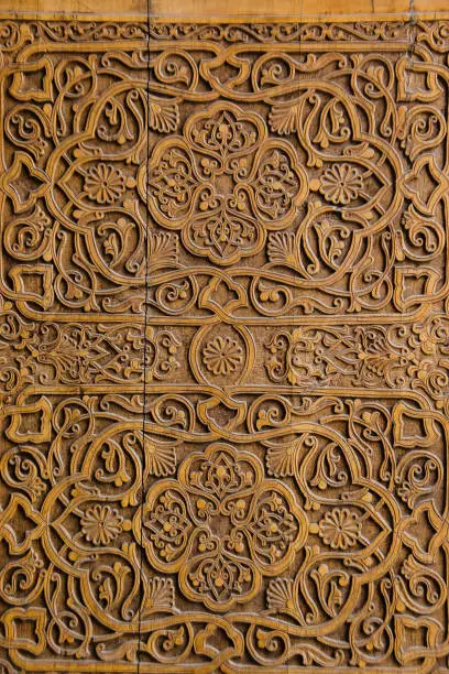 Photo of Muslim ornament carved on a wooden wall