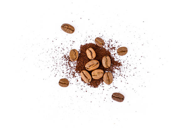 istock Roasted coffee beans with ground coffee on white background 1314290243