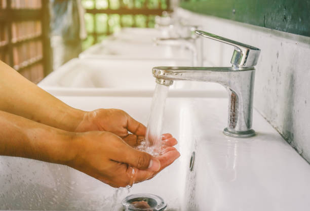 Close up Hand washing at 
Public toilet