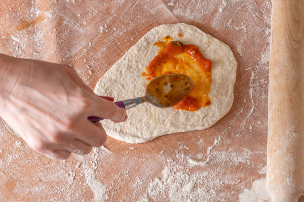 istock preparing fresh Italian raw pizza 1314294610