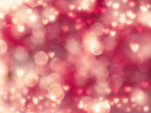 istock abstract background love colorful red pink blurs with shiny hearts 1314295921